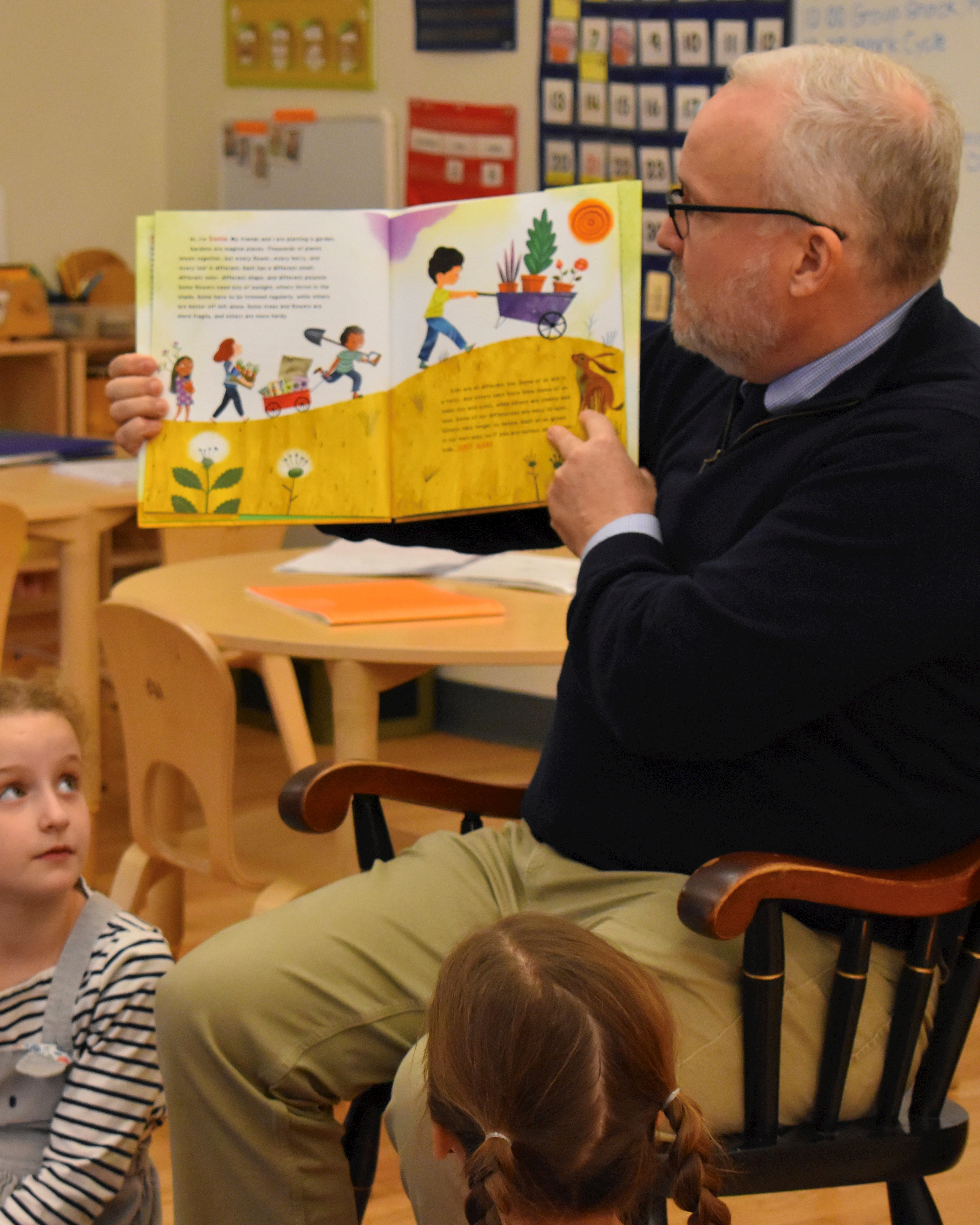 Steve Farley, Head of Kingsley Montessori School, reading children book.